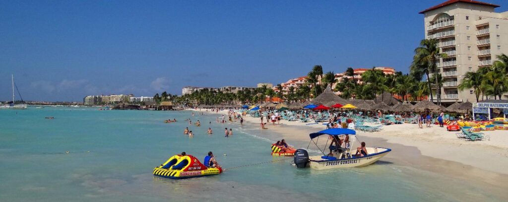 Palm Beach in Aruba lined with resorts and turquoise water
